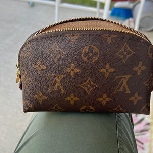 Authentic Louis Vuitton pouch used as makeup case slightly stained inside